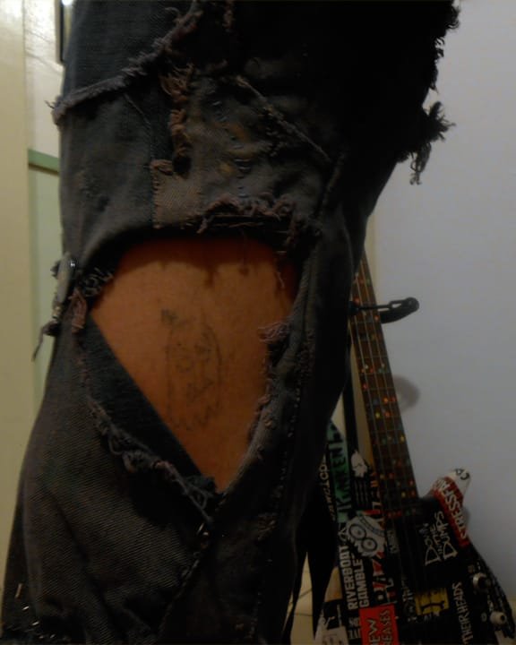 "14." 1/2/13. Calligraphy ink and sewing needle (tattoo). 1x2".